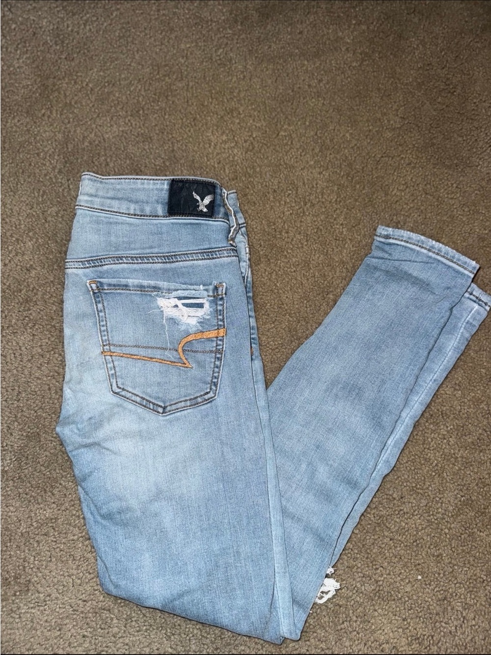 American Eagle Outfitters Light Blue Skinny Jeans with Back Pocket Distress
